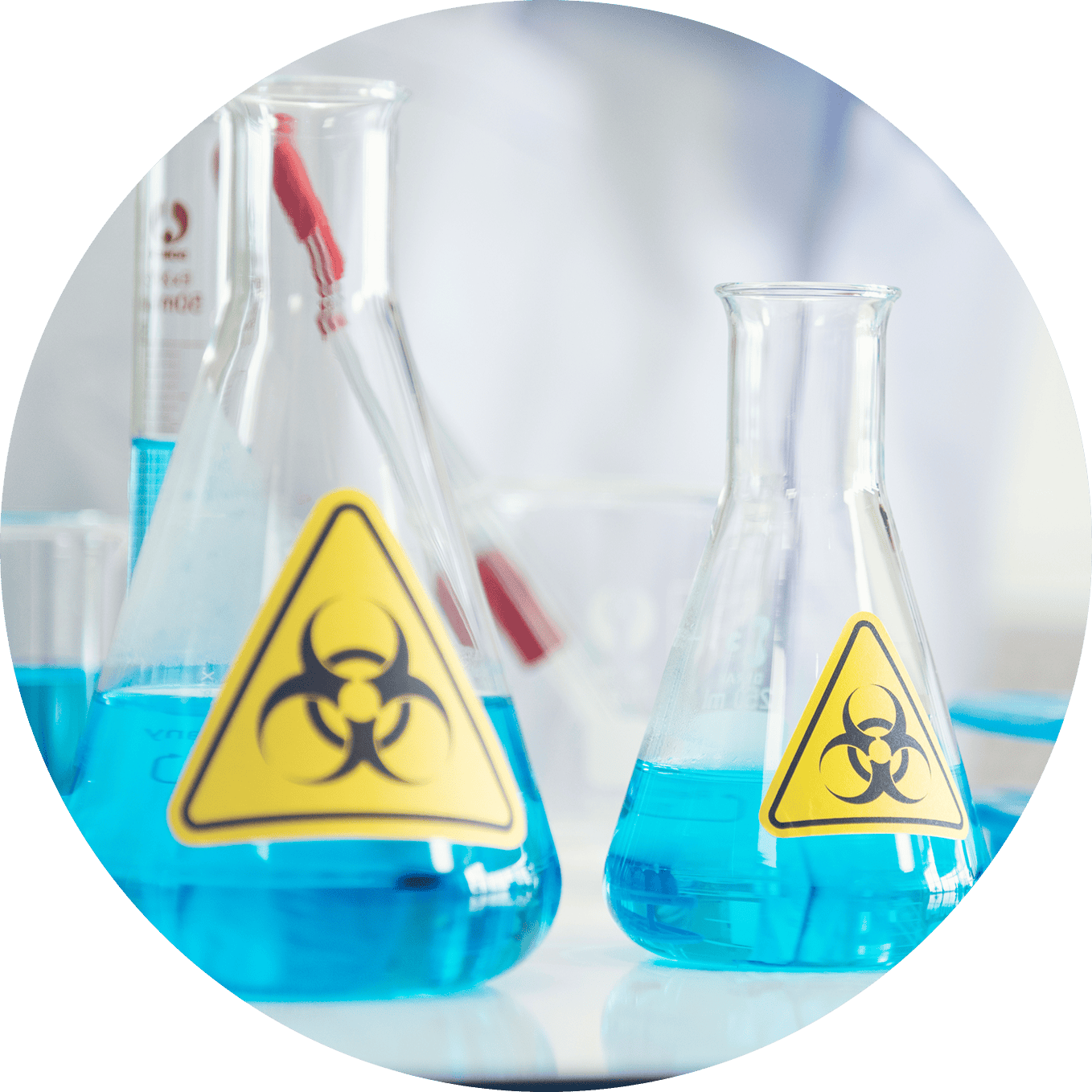 Biohazard waste containers with hazardous material symbols for proper disposal.