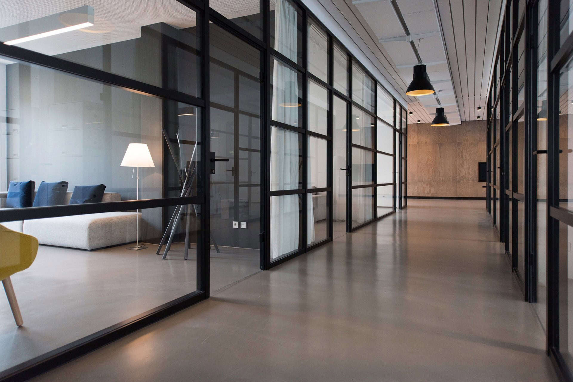 Office space with glass walls for efficient waste management and sustainability.