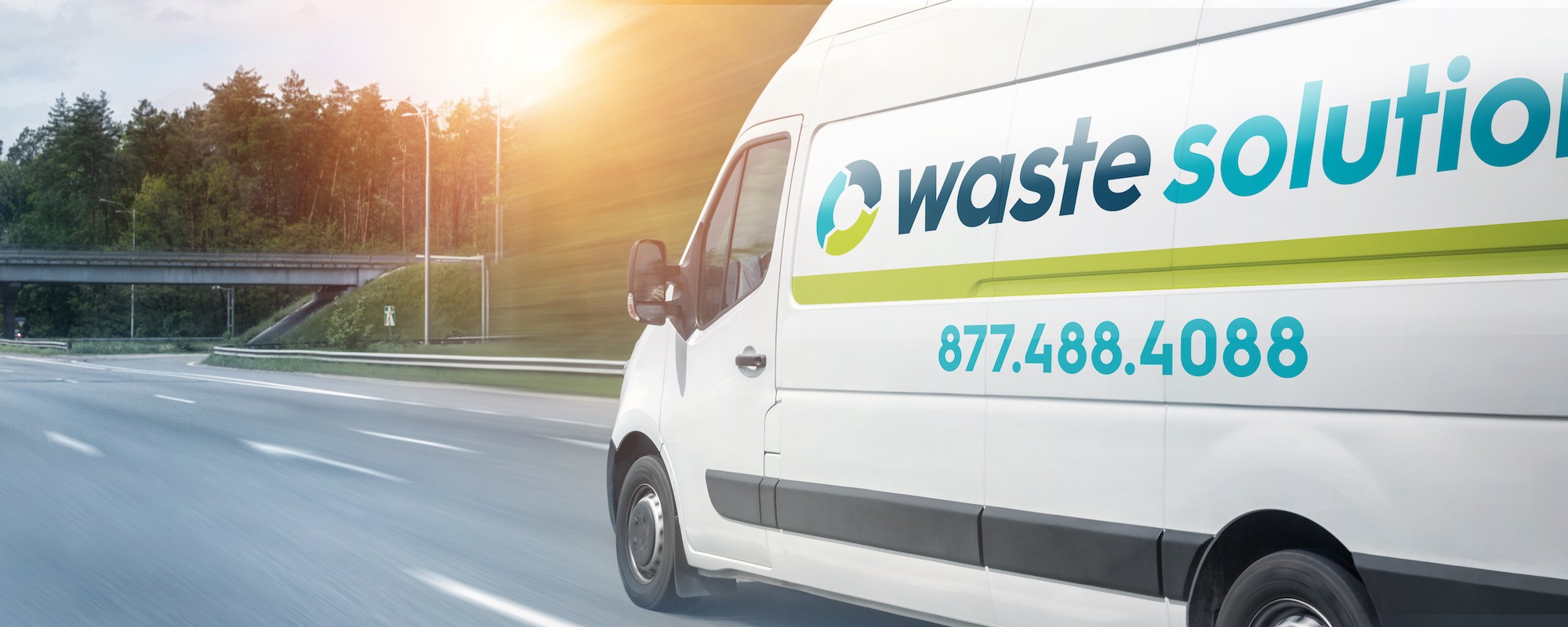 waste solutions branded sprinter van driving down road with logo and phone number visible 877 488 4088