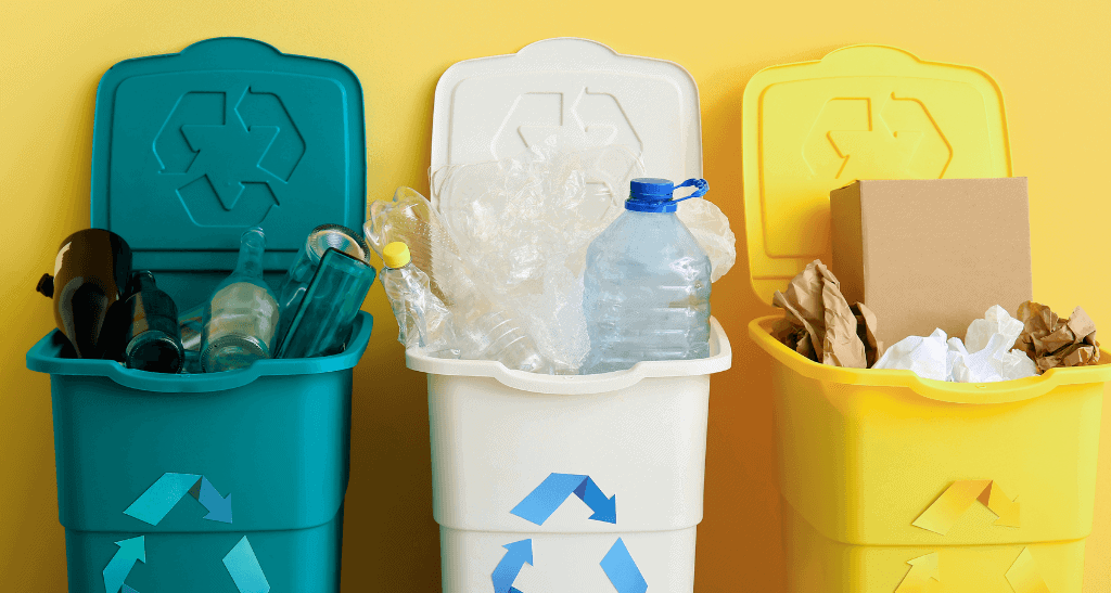 Recycling bins for waste audits highlighting regulatory compliance and reporting in waste management.