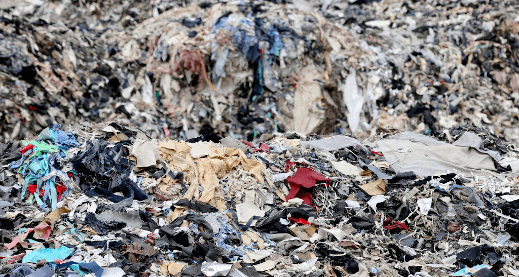 Pile of textile waste and debris highlighting challenges in Canadian waste management.
