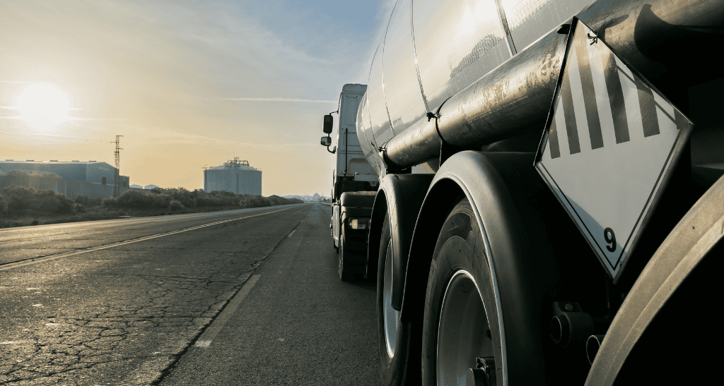 Tanker truck transporting used cooking oil for recycling and eco-friendly conversion.