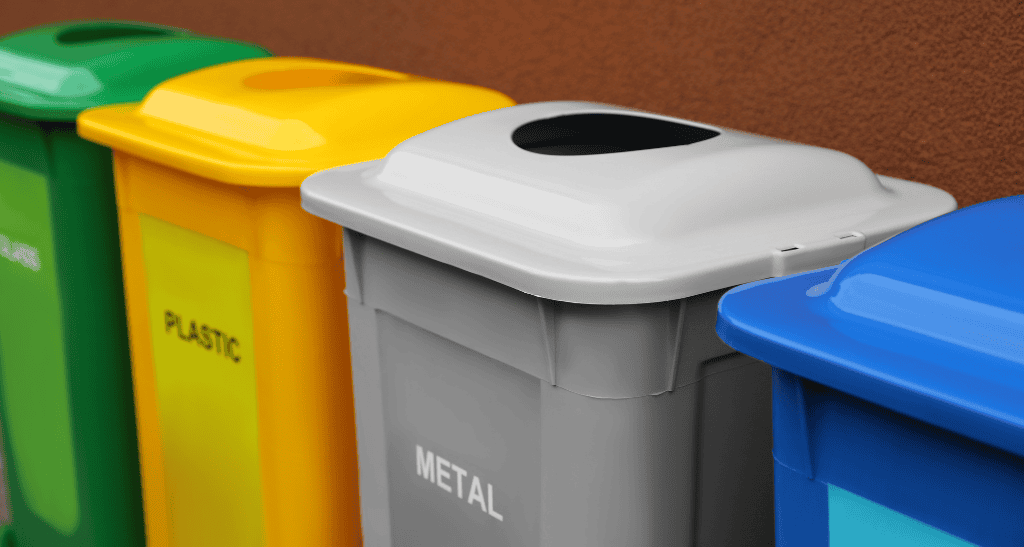 Color-coded waste bins for recycling, metal, and general waste management solutions.